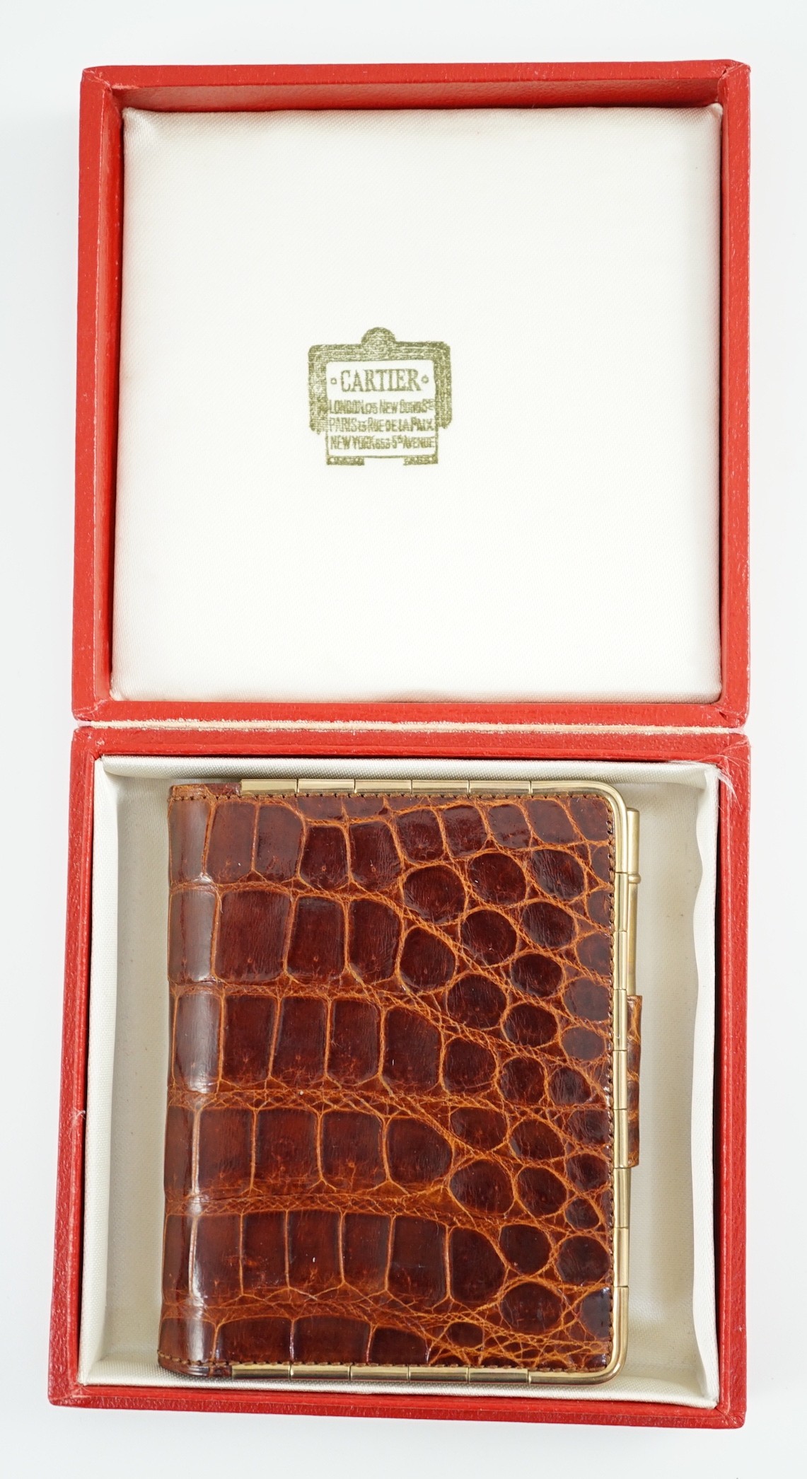 A boxed Cartier, London simulated crocodile notebook with silver pencil, unused